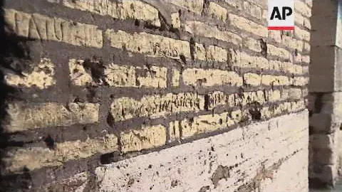 Restorers repair wall engraved by Russian tourist visiting ancient site